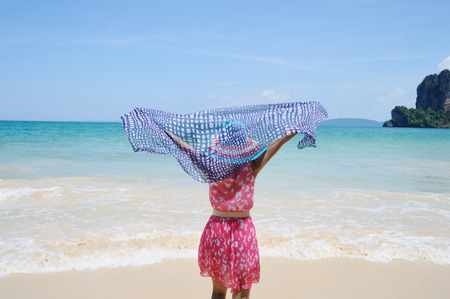 Happy Woman standing on the beach in Krabi Thailandの写真素材