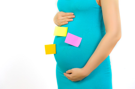 Pregnant woman touching her belly and Colorの写真素材