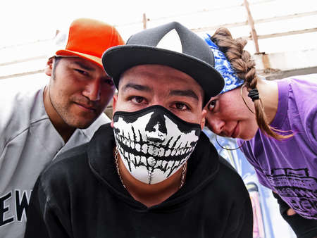 Hispanic rappers portrait at the street looking at viewerの写真素材