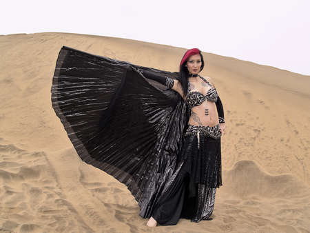 Pose and clothes of an arab dance by a young female dancerの写真素材