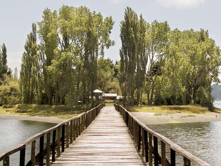 Little island in the big island of Chiloe, Chile, connected by a bridgeの写真素材