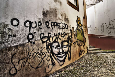 Coimbra, December 2012. Graffiti on a street in downtown. "What is needed is to play around / jump"のeditorial素材