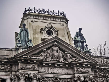 Oporto, December 2012. Bank of Portugal headquarters of Oporto. Detail of facade on top. Founded 1846 in Lisbon, nationalized in 1974.のeditorial素材