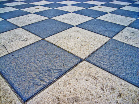 Chessboard style floor on white and blueの写真素材