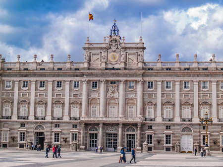 Madrid, May 2012. Royal Palace. Built in 1738 - 1892 on baroque style by Juvara, Sachetti and Sabatini architects. Spanish National Heritage. Tourist landmark. Largest palace in Europe. Some people visiting the site.のeditorial素材