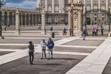 Madrid, May 2012. Royal Palace. Built in 1738 - 1892 on baroque style by Juvara, Sachetti and Sabatini architects. Spanish National Heritage. Tourist landmark. Largest palace in Europe. Some people visiting the site and taking photographies.のeditorial素材