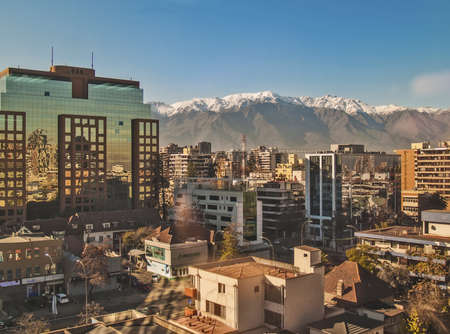 Santiago, June 2013. Financial and residential district Las Condes with The Andes mountains covered with snow on backgroundのeditorial素材