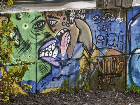 Villarrica, June 2013. Graffiti of two people kissing on a wall.のeditorial素材