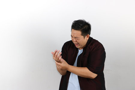 Man Holding His wrist in bad Painの写真素材