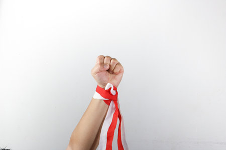 Asian young man with a flag - isolated on white.