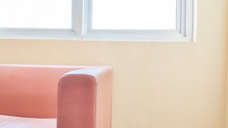 Sofa and window in the room,vintage color tone