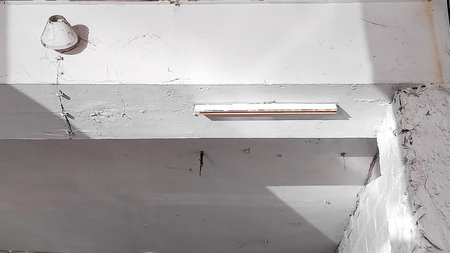 interior of a new house under construction with white walls and ceilingの写真素材