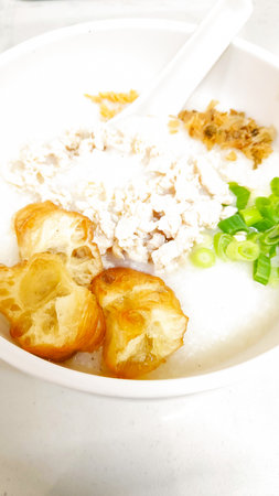 Rice porridge with sour cream and crispy croutons.の写真素材