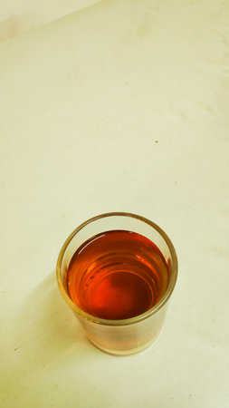 A glass of black tea on a white background. Selective focus.の写真素材