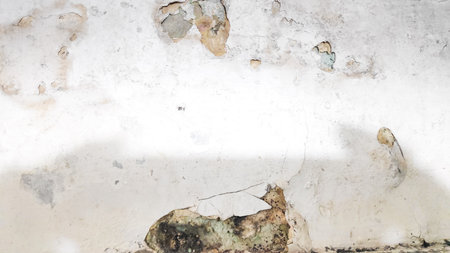 Old wall with cracks and peeling paint. Abstract grunge backgroundの写真素材