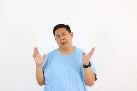 Man expressing disgust with open hands and a wrinkled face