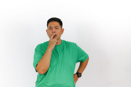 Portrait of an Indonesian trying to solve a problem with a serious and focused face.
