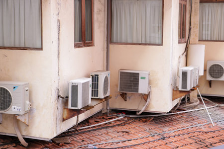 Exterior cooling system featuring several air conditioning units in a row