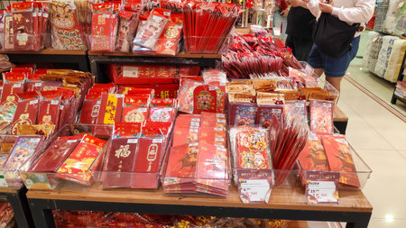 Red Chinese New Year red envelopes or hongbao are displayed on shelves at a retail store during festival, Bandung, Indonesia 16 February 2026のeditorial素材