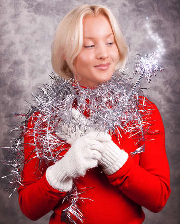 Portrait of a sexy blonde holding magic wandの写真素材