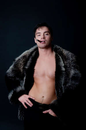 Picture of guy smoking in the darkの写真素材