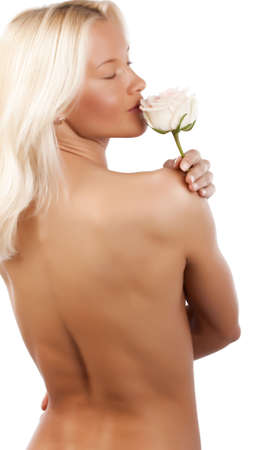 Picture of attractive young woman smelling a roseの写真素材