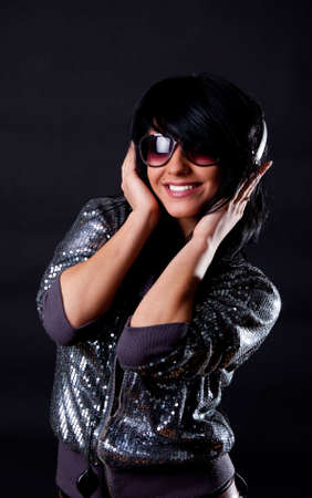 Sexy smiling female listening music and smilingの写真素材