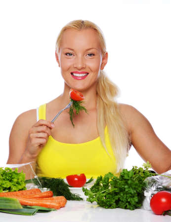 Portrait of sexy woman eating on the kitchenの写真素材