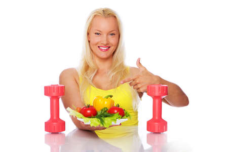 Portrait of sexy woman eating on the kitchenの写真素材
