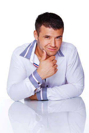 Portrait of handsome man posing in studio in shirtの写真素材