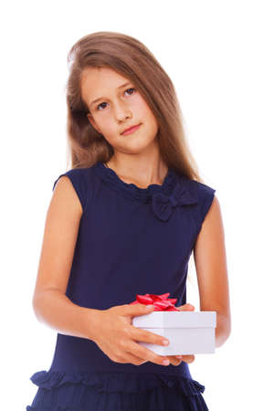 Portrait of little kid posing in studio with presentの写真素材