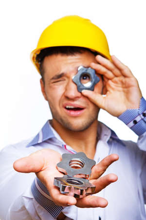Portrait of worker posing in studio with screwの写真素材