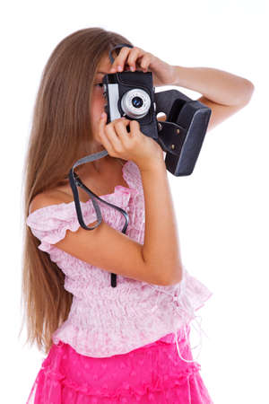 Portrait of beautiful girl posing in studio with cameraの写真素材