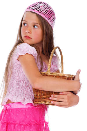 Portrait of beautiful girl posing in studio with basketの写真素材