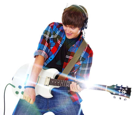 Portrait of rock artist posint in studio with guitar