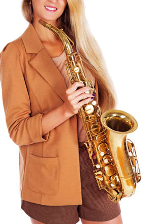 Portrait of sexy woman posing in studio with musical instrumentの写真素材