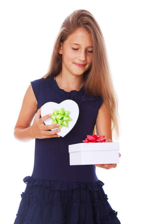 Portrait of little kid posing in studio with presentの写真素材