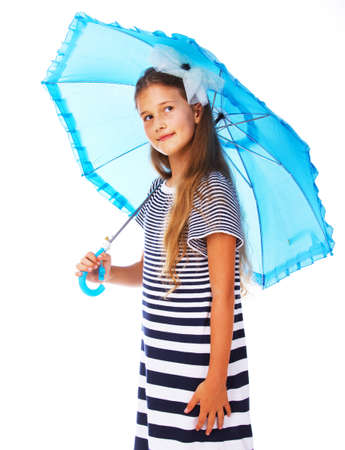 Portrait of little kid posing in studio with umbrella in rainy dayの写真素材
