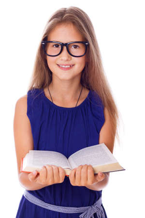 Portrait of little teacher posing in studio with bookの写真素材