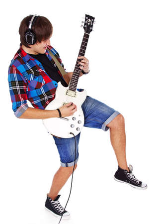 Portrait of rock artist posint in studio with guitarの写真素材