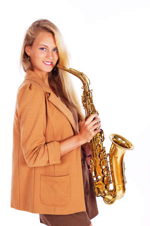 Portrait of sexy woman posing in studio with musical instrumentの写真素材