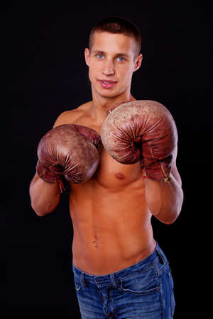 A handsome young boxer is in a guard positionの写真素材