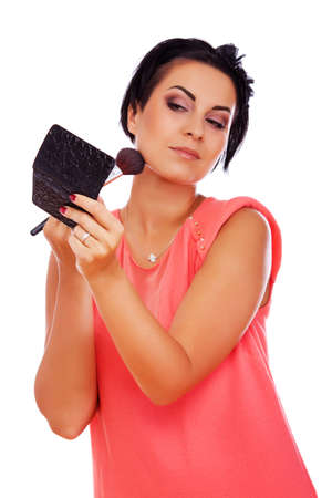 Portrait of sexy woman posing in studio with cosmeticの写真素材