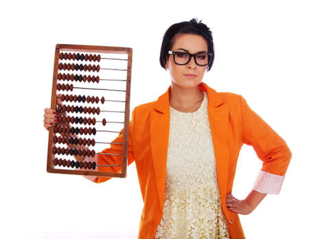 Portrait of sexy teacher posing in studio with old calculator