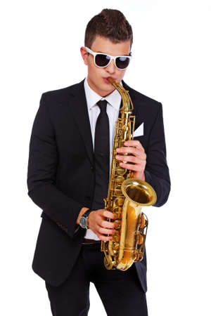 A handsome jazzman playing saxophoneの写真素材