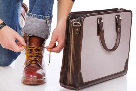 Close portrait of man shoes near the bagの写真素材