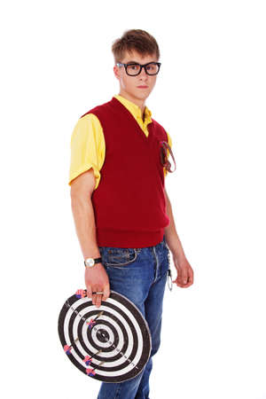 Portrait of tipical nerd posing in studio with dartsの写真素材