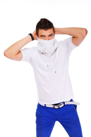 A young man is hiding his faceの写真素材