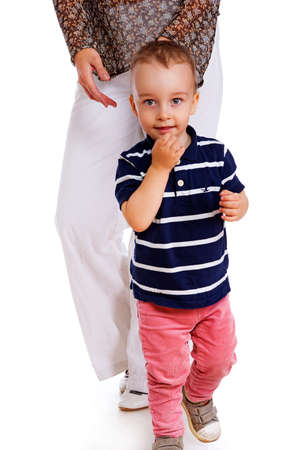 Portrait of little biy with his mom posing in studioの写真素材