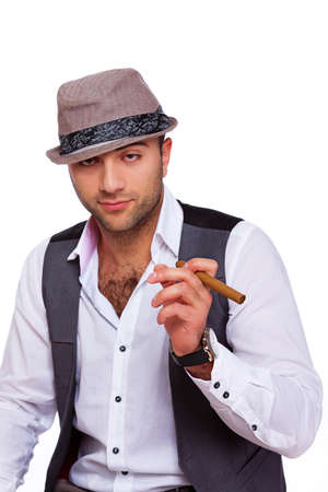Photo of a calm gentleman with a cigarの写真素材